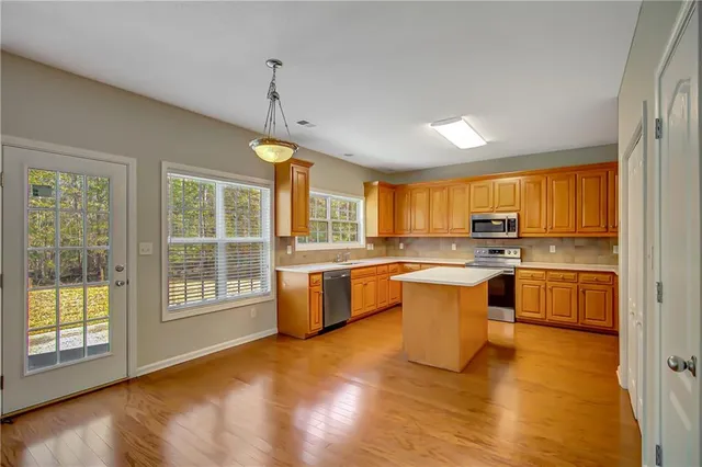a view of an empty room with a window
