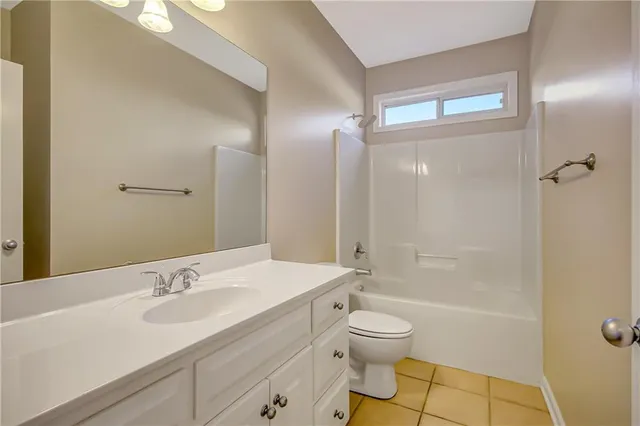 a bathroom with a sink a vanity and a mirror