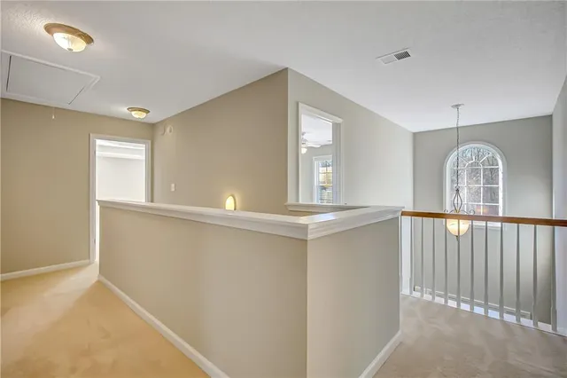 a white bath tub sitting next to a shower