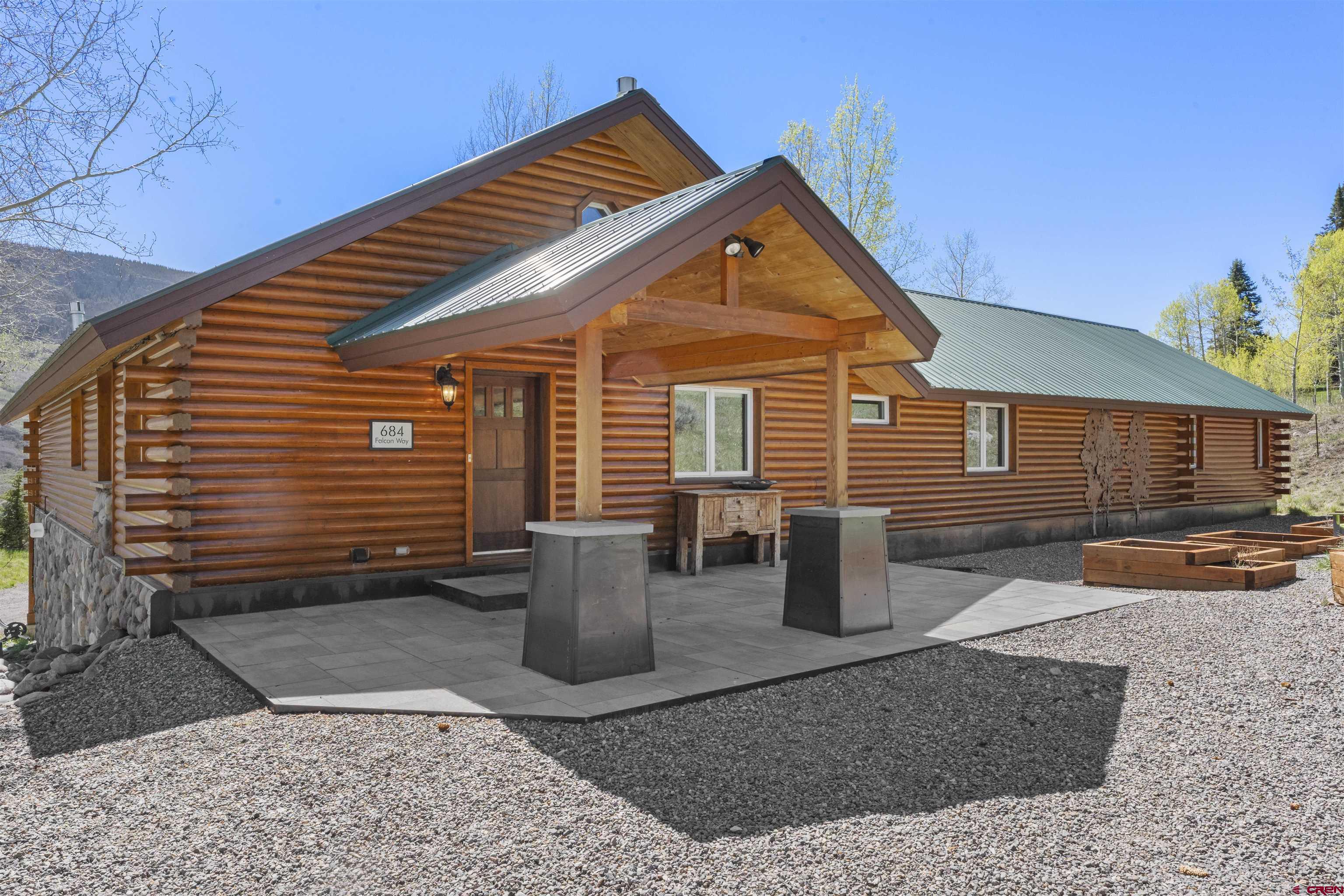 684 Falcon Way Montrose, CO 81403 - Photo 3 of 43 a front view of a house with patio