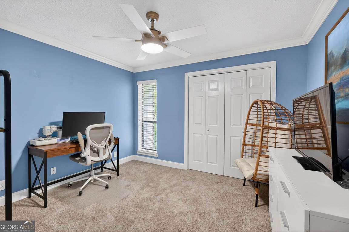 2514 Demere Road, Unit 7 St. Simons, GA 31522 - Photo 5 of 22 a view of a workspace with furniture and a window