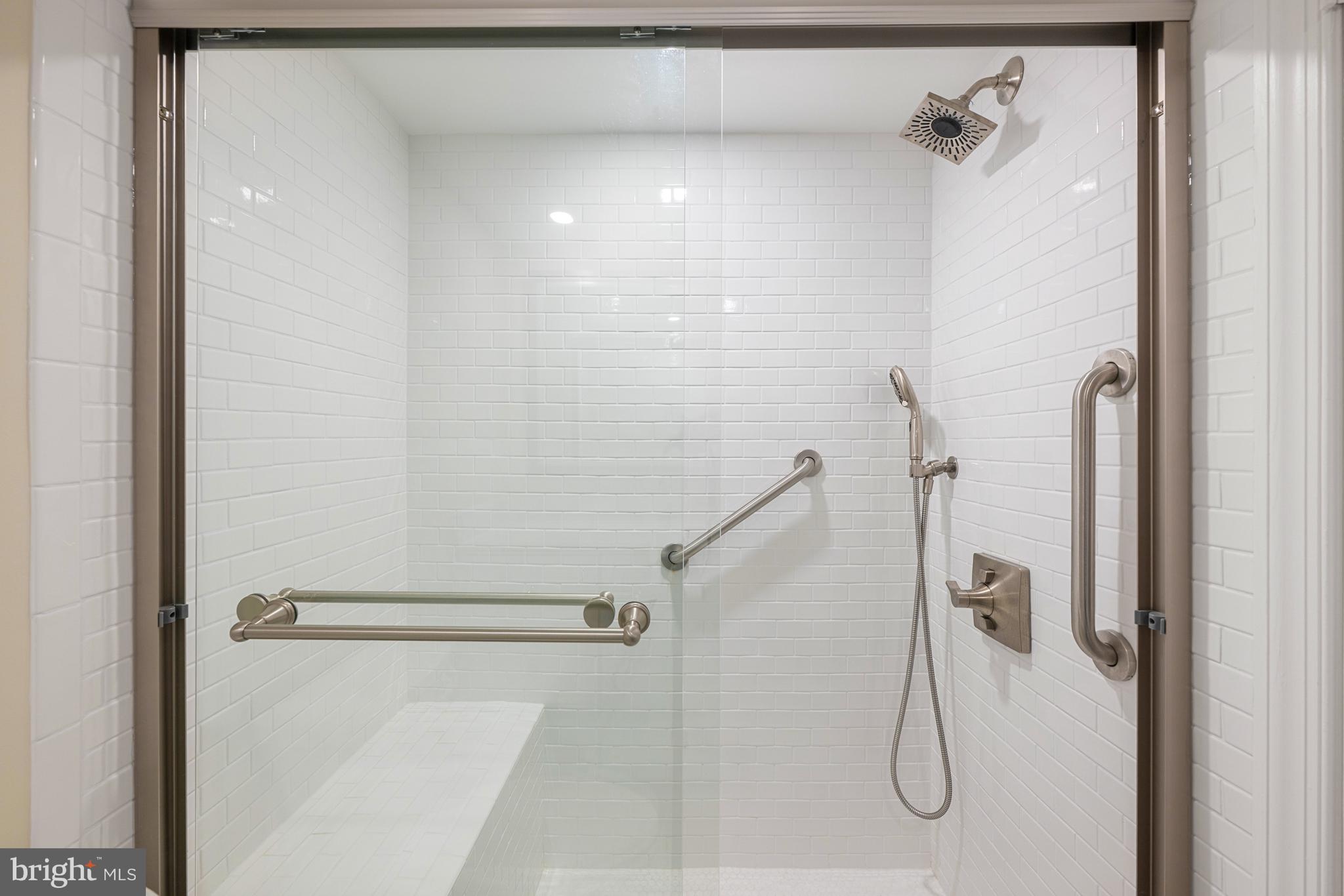 11400 Strand Drive, Unit R310 Rockville, MD 20852 - Photo 28 of 35 a bathroom with a shower