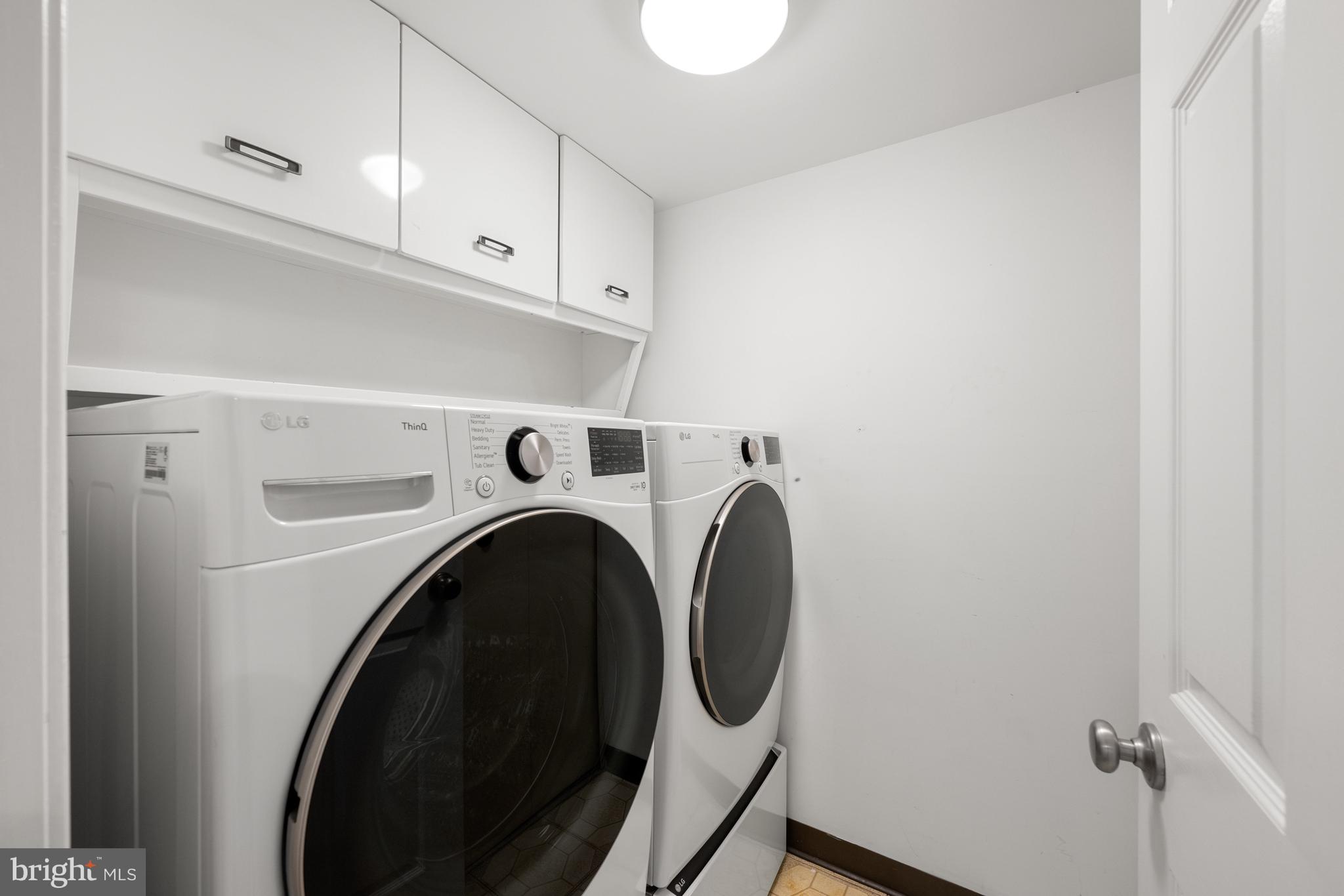 11400 Strand Drive, Unit R310 Rockville, MD 20852 - Photo 29 of 35 a utility room with dryer and washer
