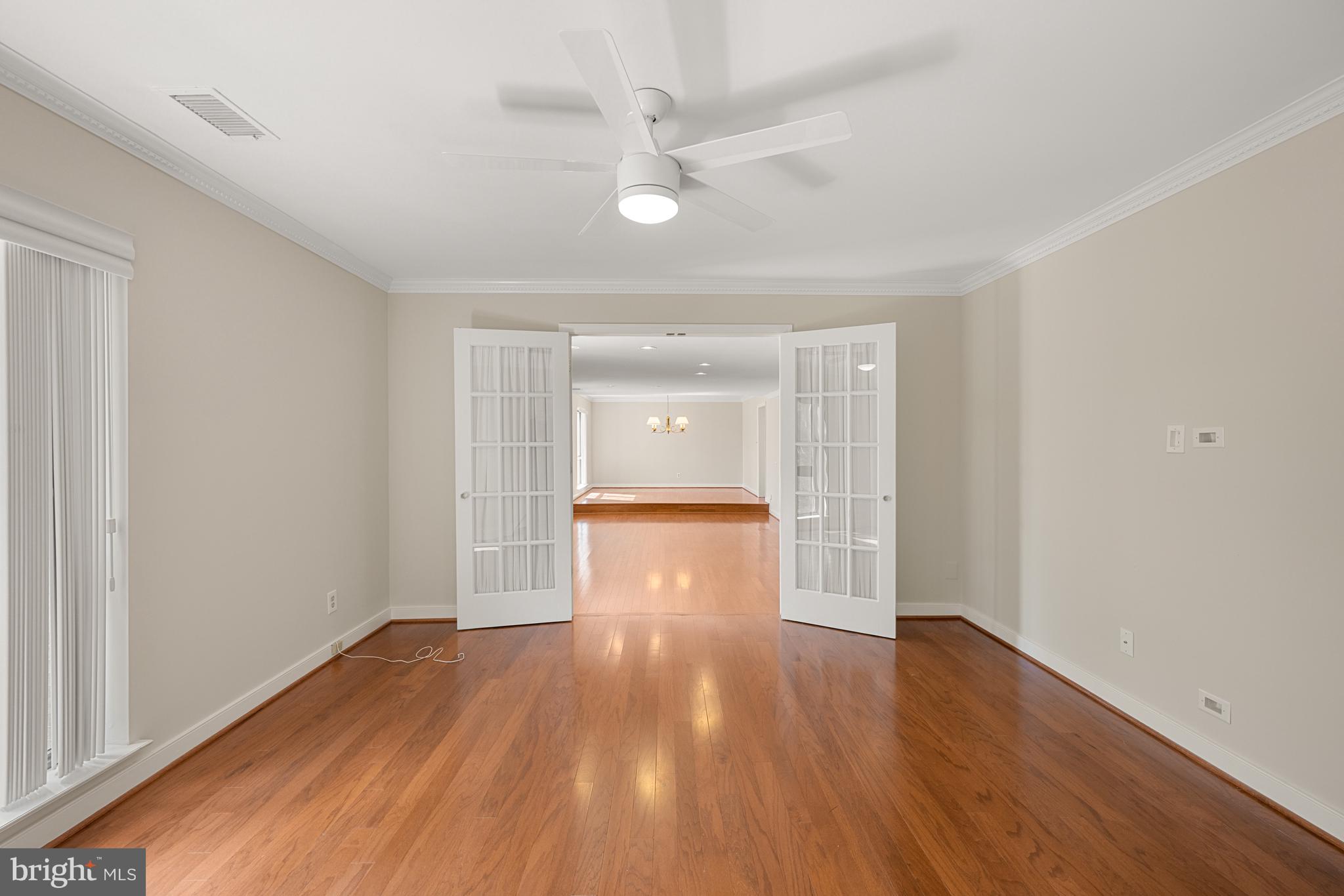 11400 Strand Drive, Unit R310 Rockville, MD 20852 - Photo 8 of 35 wooden floor in an empty room with a window