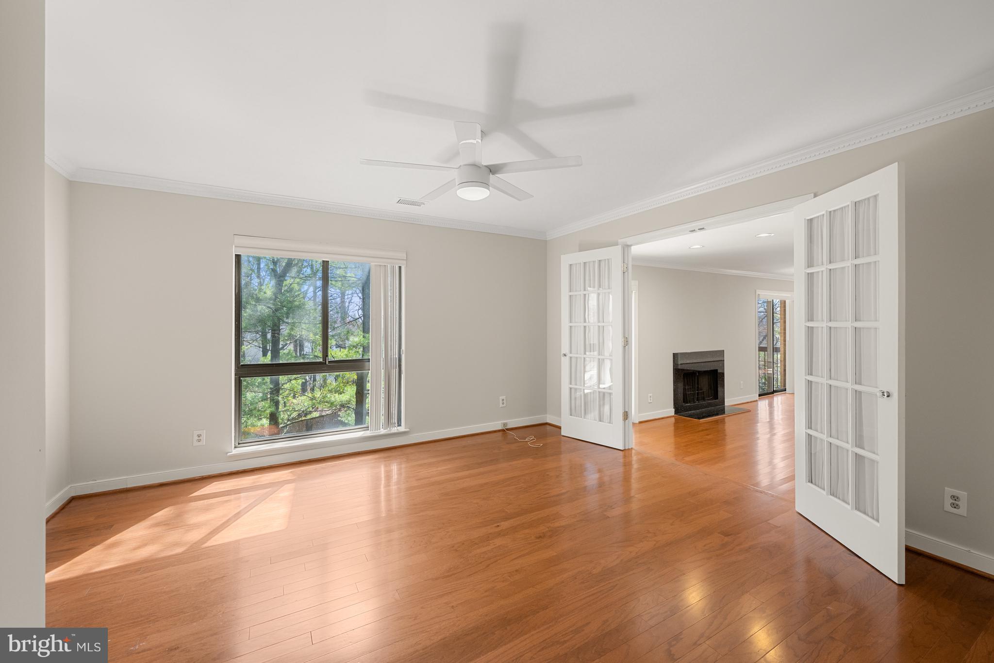 11400 Strand Drive, Unit R310 Rockville, MD 20852 - Photo 9 of 35 a view of empty room with wooden floor and fan