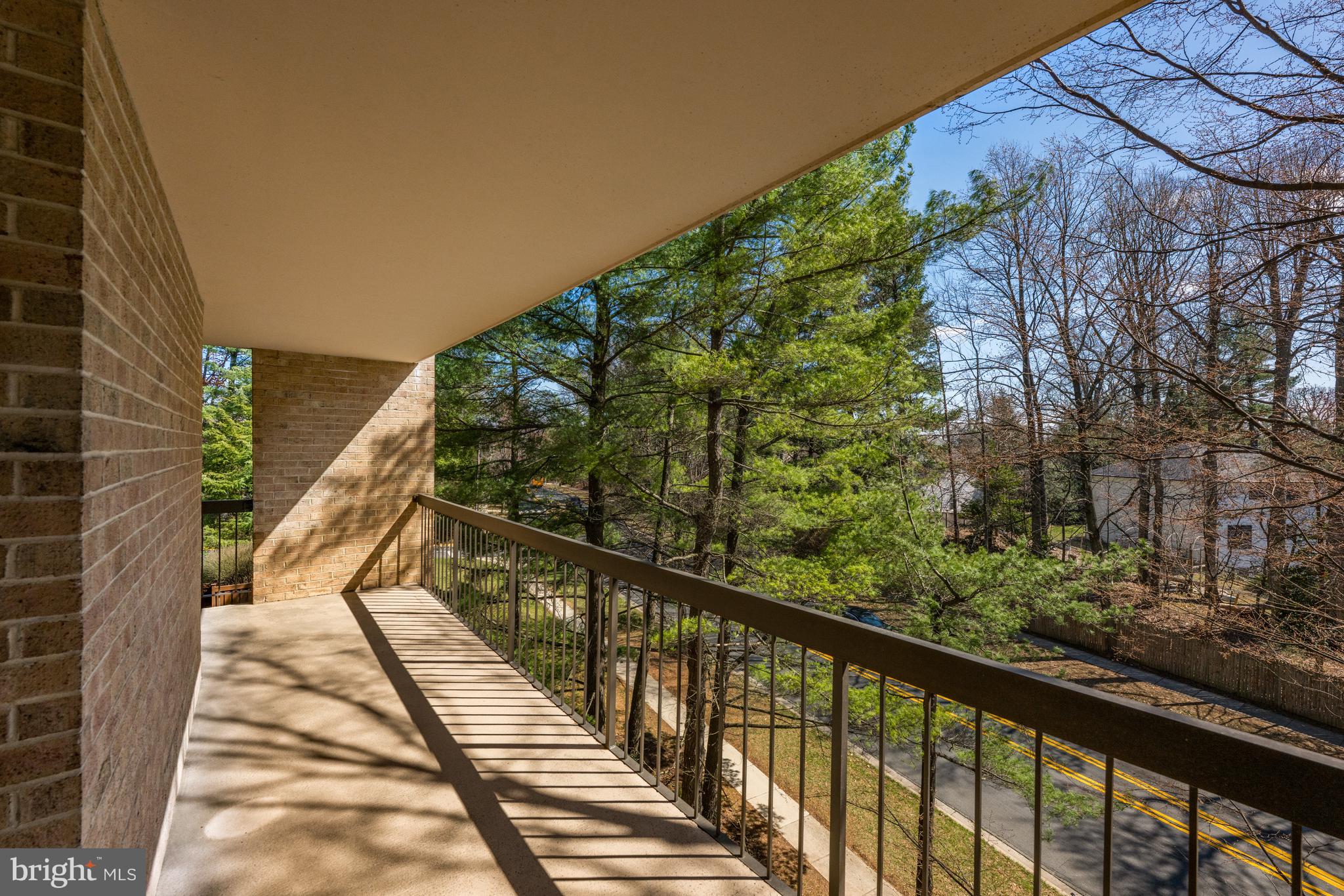 11400 Strand Drive, Unit R310 Rockville, MD 20852 - Photo 10 of 35 a view of balcony with wooden floor and fence