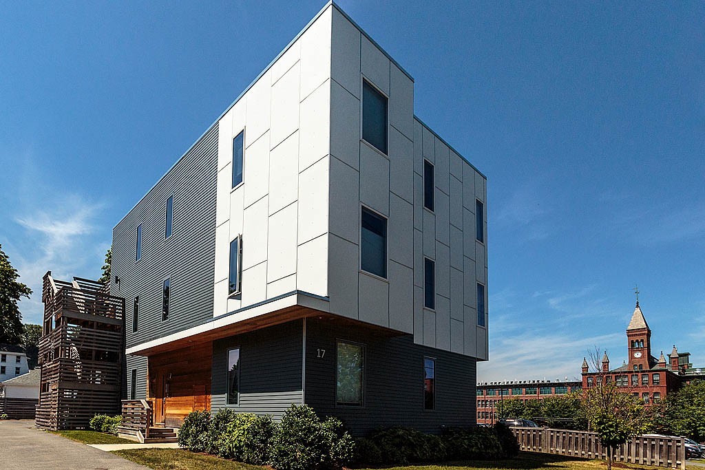 a view of a blue building with many windows