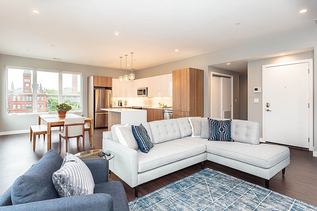 17 Ash Street Waltham, MA 02453 - Photo 13 of 32 a living room with furniture and a large window