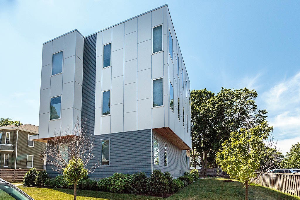 17 Ash Street Waltham, MA 02453 - Photo 23 of 32 a front view of a house with garden