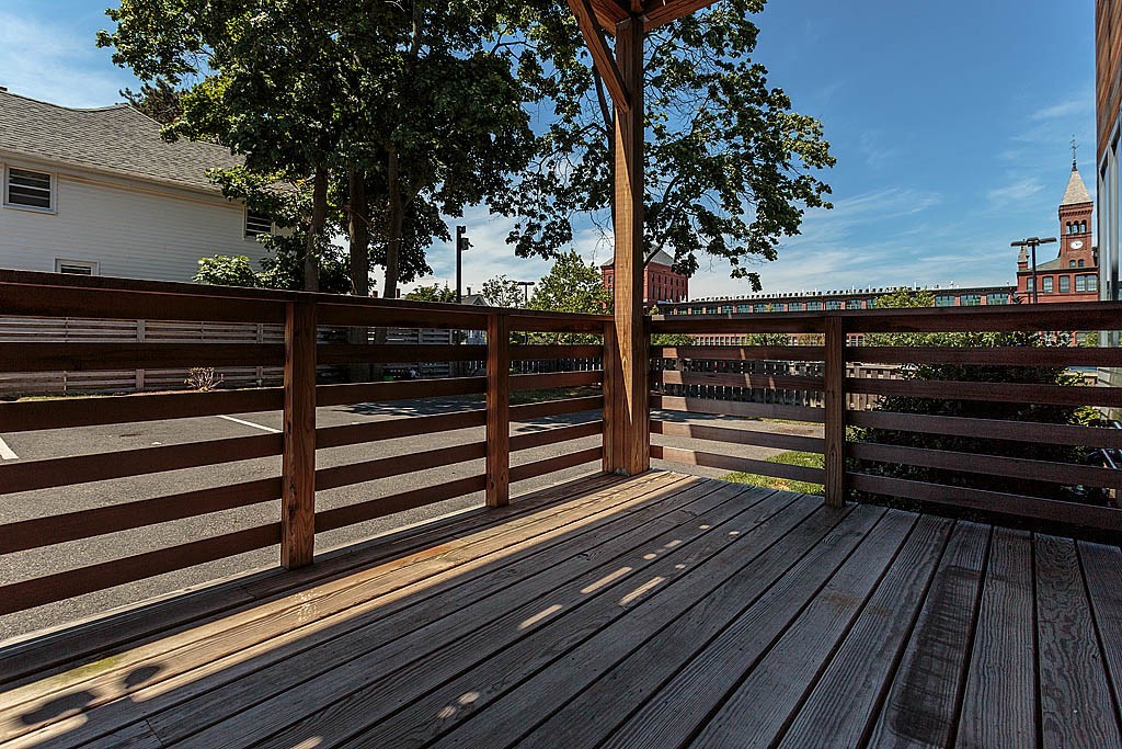 17 Ash Street Waltham, MA 02453 - Photo 26 of 32 a view of a balcony with a iron gate