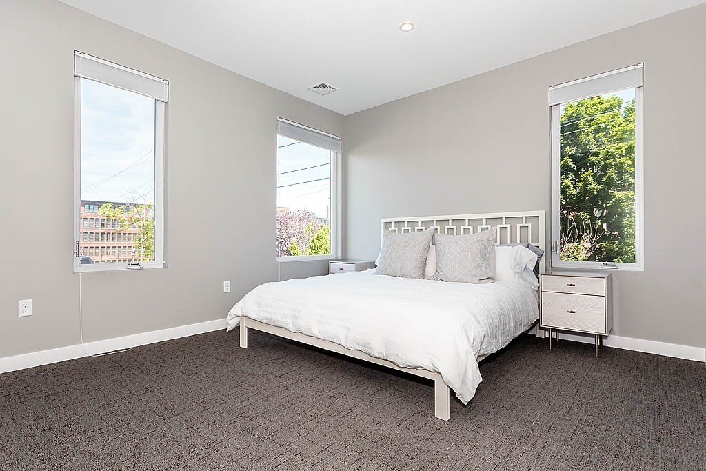 17 Ash Street Waltham, MA 02453 - Photo 8 of 32 a bedroom with a bed and window