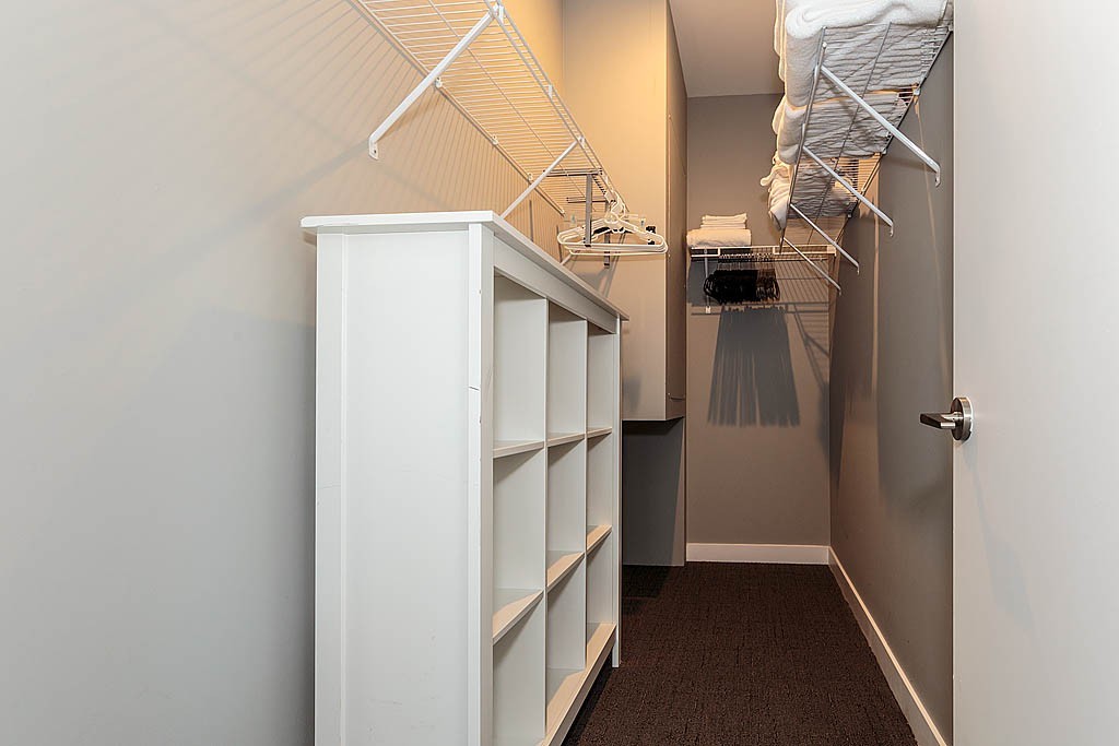 17 Ash Street Waltham, MA 02453 - Photo 9 of 32 a view of walk in closet with clothes