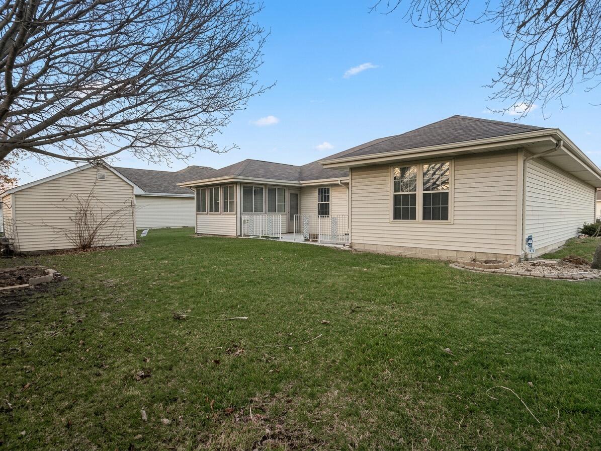 2962 Liberty Drive Crown Point, IN 46307 - Photo 17 of 18 a front view of a house with a garden