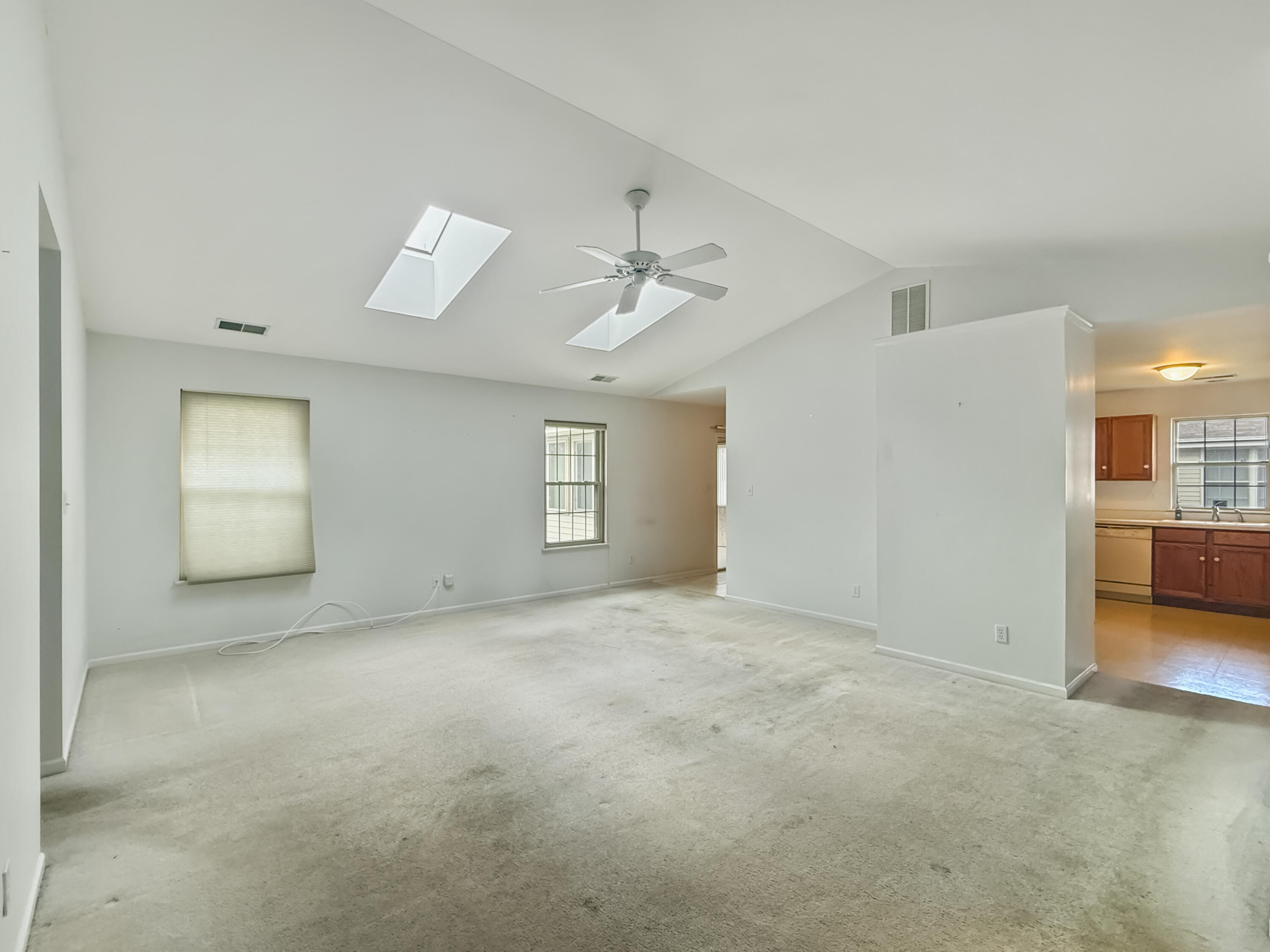 2962 Liberty Drive Crown Point, IN 46307 - Photo 2 of 18 a view of a livingroom with a ceiling fan and window
