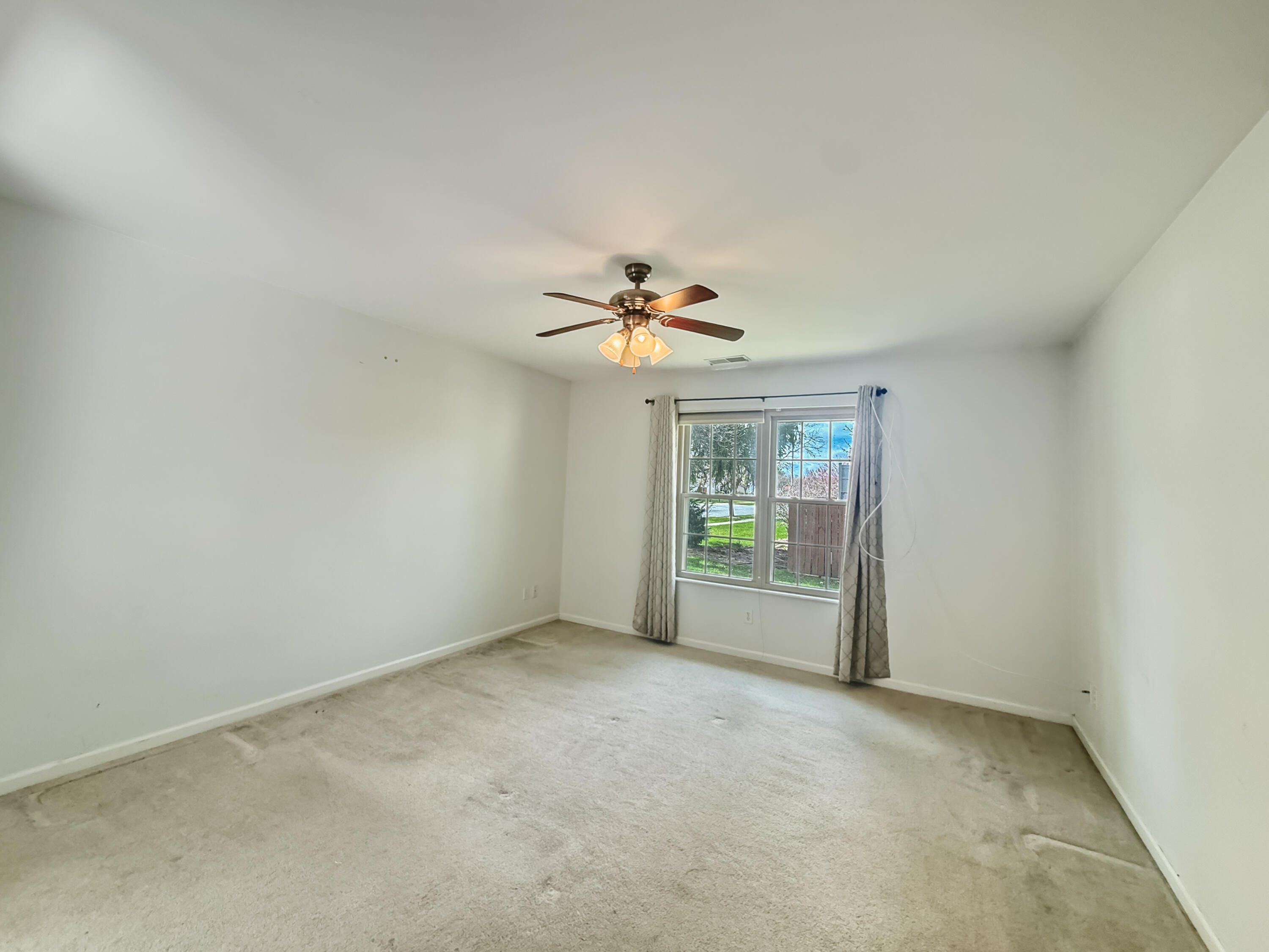 2962 Liberty Drive Crown Point, IN 46307 - Photo 6 of 18 a view of a livingroom with a ceiling fan and window