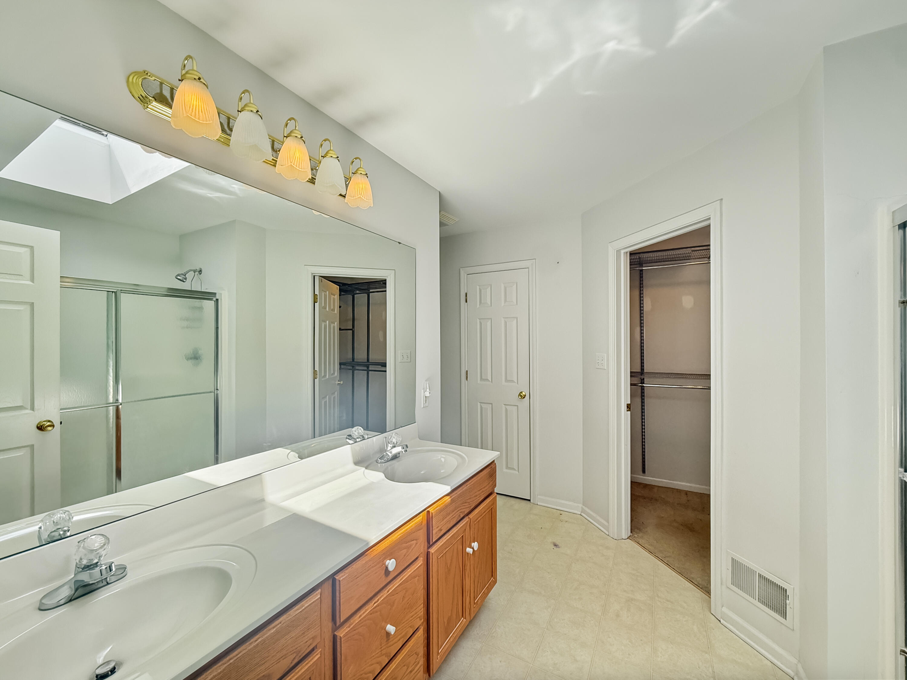 2962 Liberty Drive Crown Point, IN 46307 - Photo 7 of 18 a bathroom with a sink and a mirror