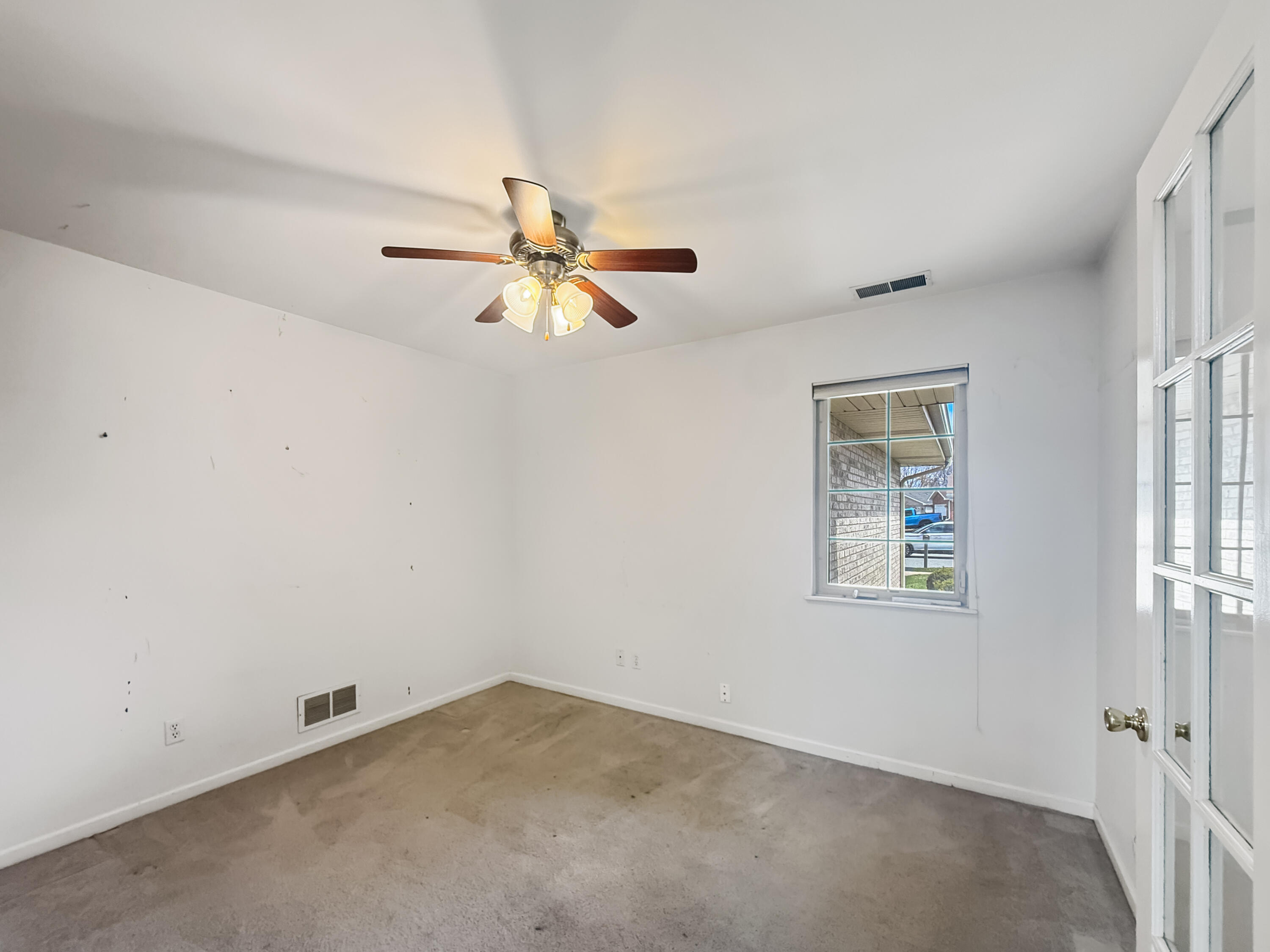 2962 Liberty Drive Crown Point, IN 46307 - Photo 10 of 18 an empty room with a window and a fan