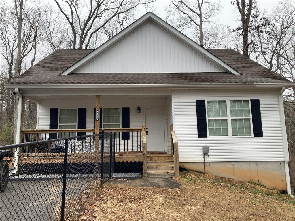 3780 Highway 52 Dahlonega, GA 30533 - Photo 1 of 19 a front view of a house with glass windows