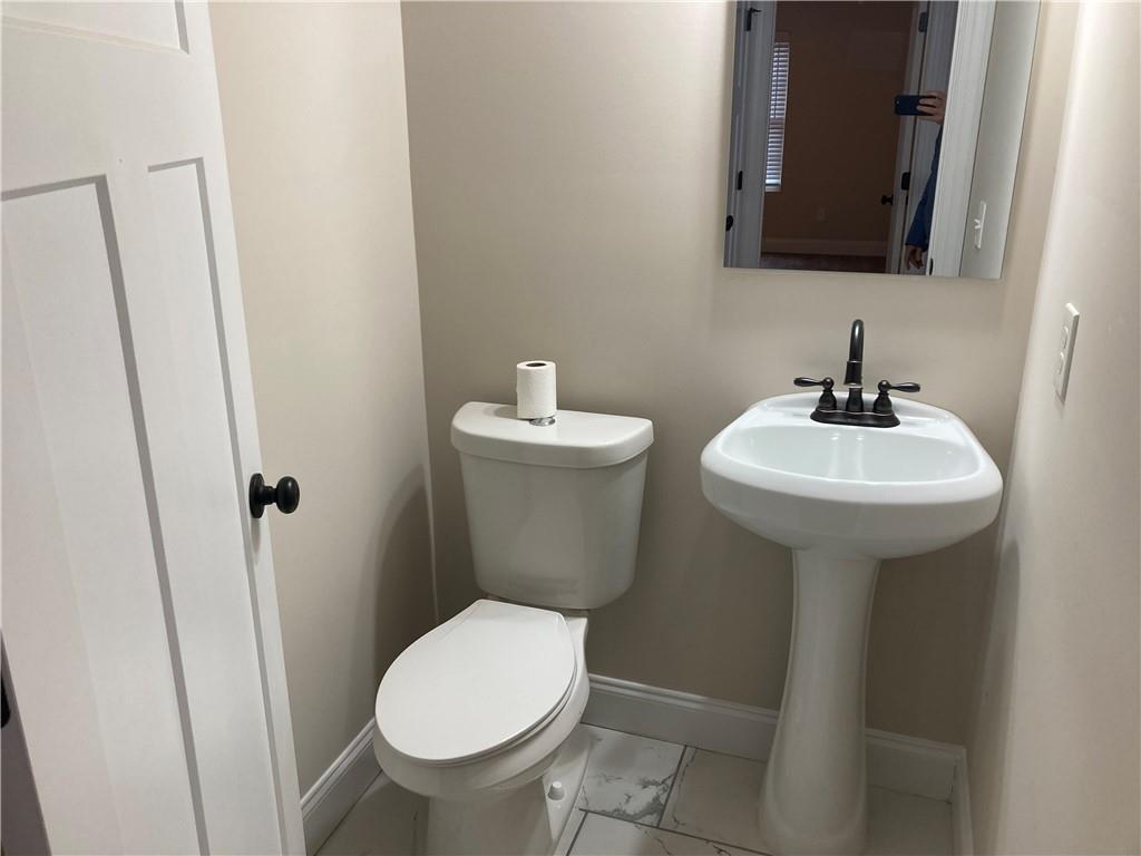 3780 Highway 52 Dahlonega, GA 30533 - Photo 12 of 19 a bathroom with a sink toilet and a mirror