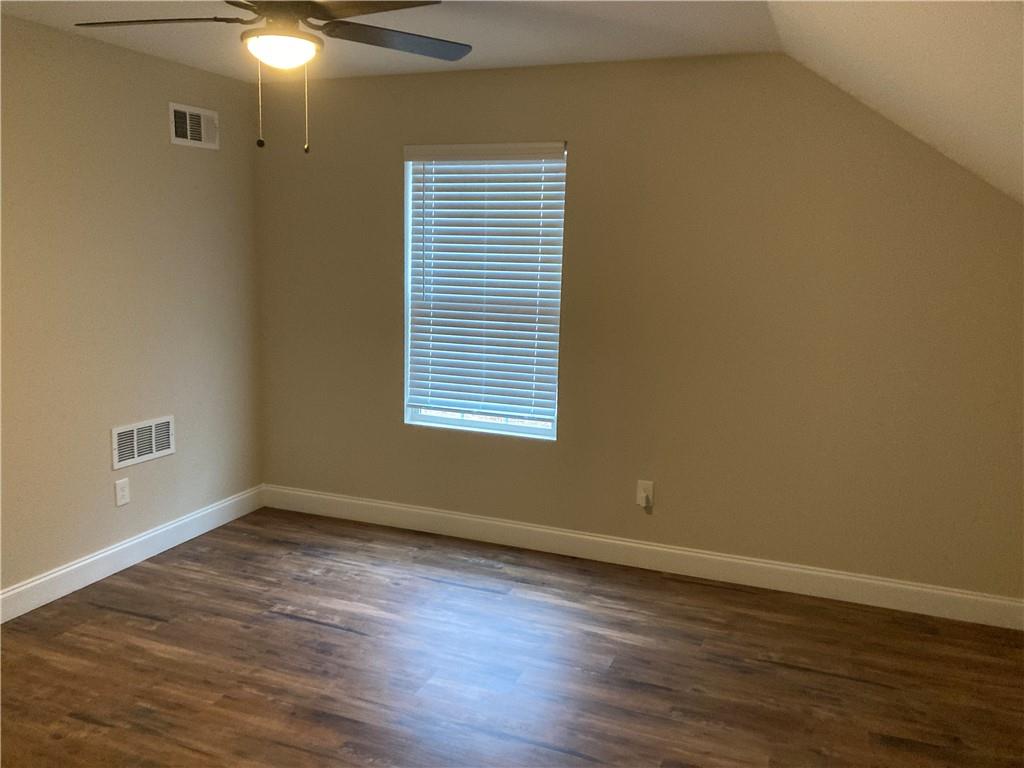 3780 Highway 52 Dahlonega, GA 30533 - Photo 13 of 19 a view of an empty room with wooden floor and a window