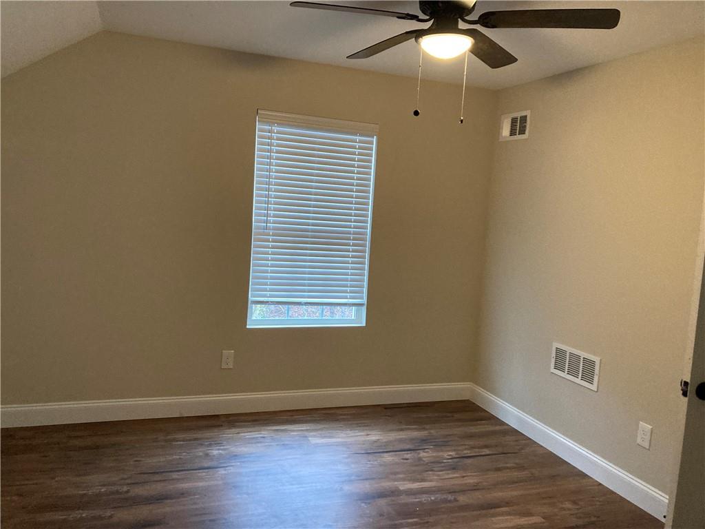 3780 Highway 52 Dahlonega, GA 30533 - Photo 15 of 19 a view of an empty room with wooden floor and a window