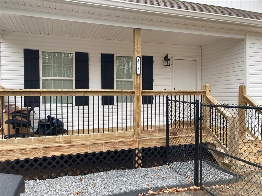 3780 Highway 52 Dahlonega, GA 30533 - Photo 2 of 19 a view of a house with a wooden fence