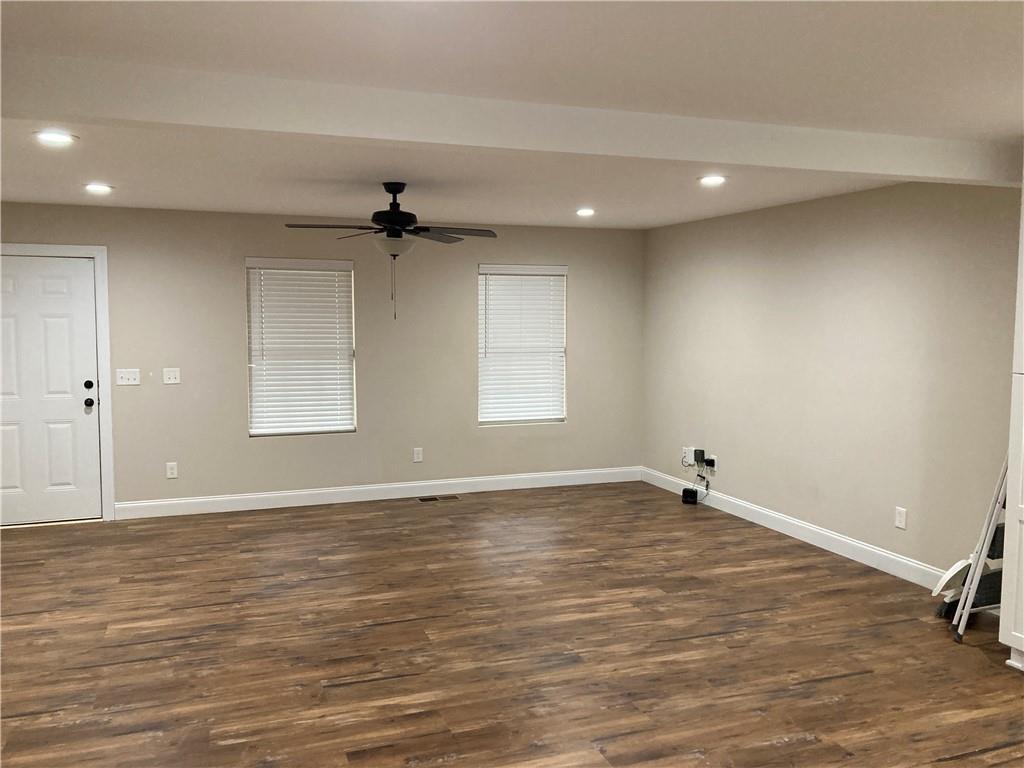 3780 Highway 52 Dahlonega, GA 30533 - Photo 4 of 19 wooden floor in an empty room with a window