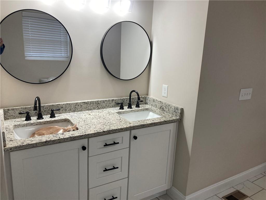 3780 Highway 52 Dahlonega, GA 30533 - Photo 8 of 19 a bathroom with a granite countertop double vanity and a mirror