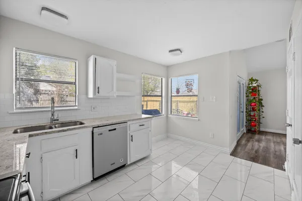 a kitchen with a sink and cabinets