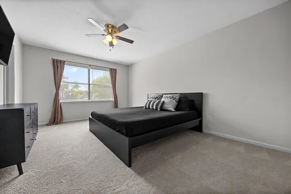 a living room with furniture and windows
