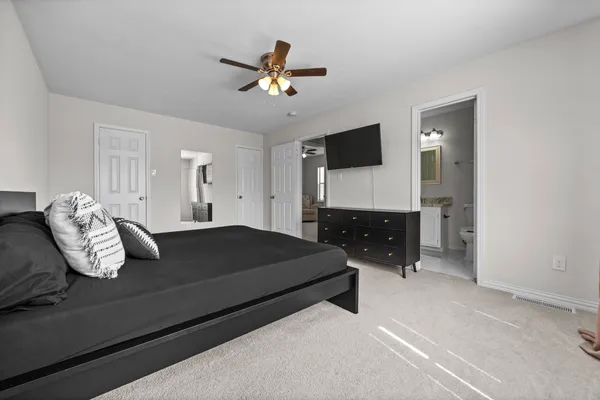 a bedroom with furniture and a bed