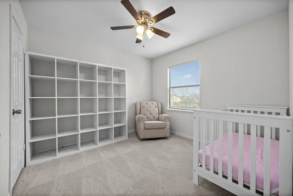 a bedroom with furniture and a window