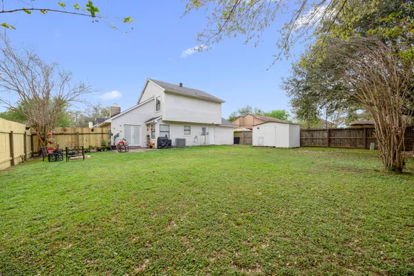 a front view of house with yard and seating area