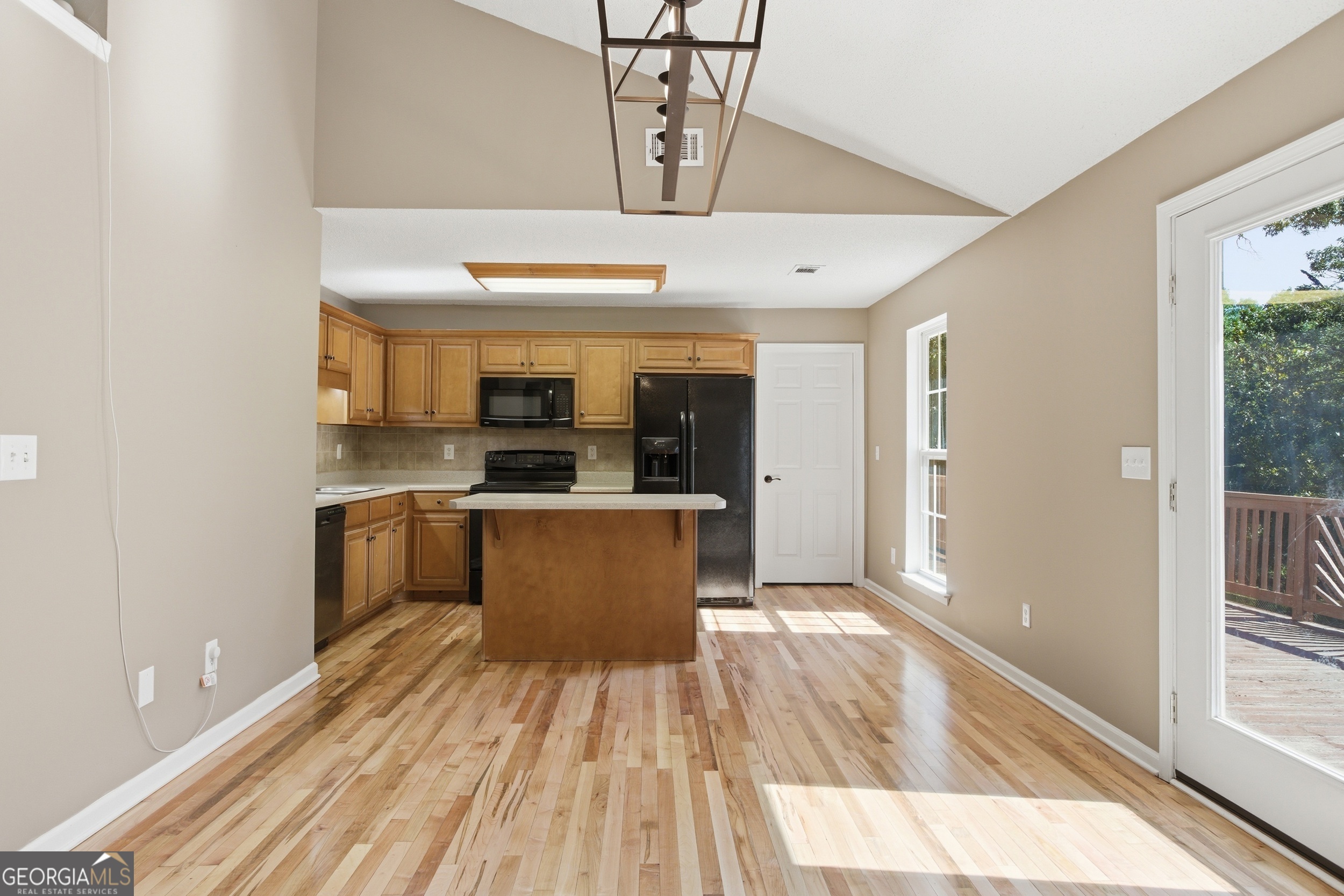 171 Winding Way Hartwell, GA 30643 - Photo 11 of 37 a large kitchen with stainless steel appliances a large counter top a stove and a refrigerator