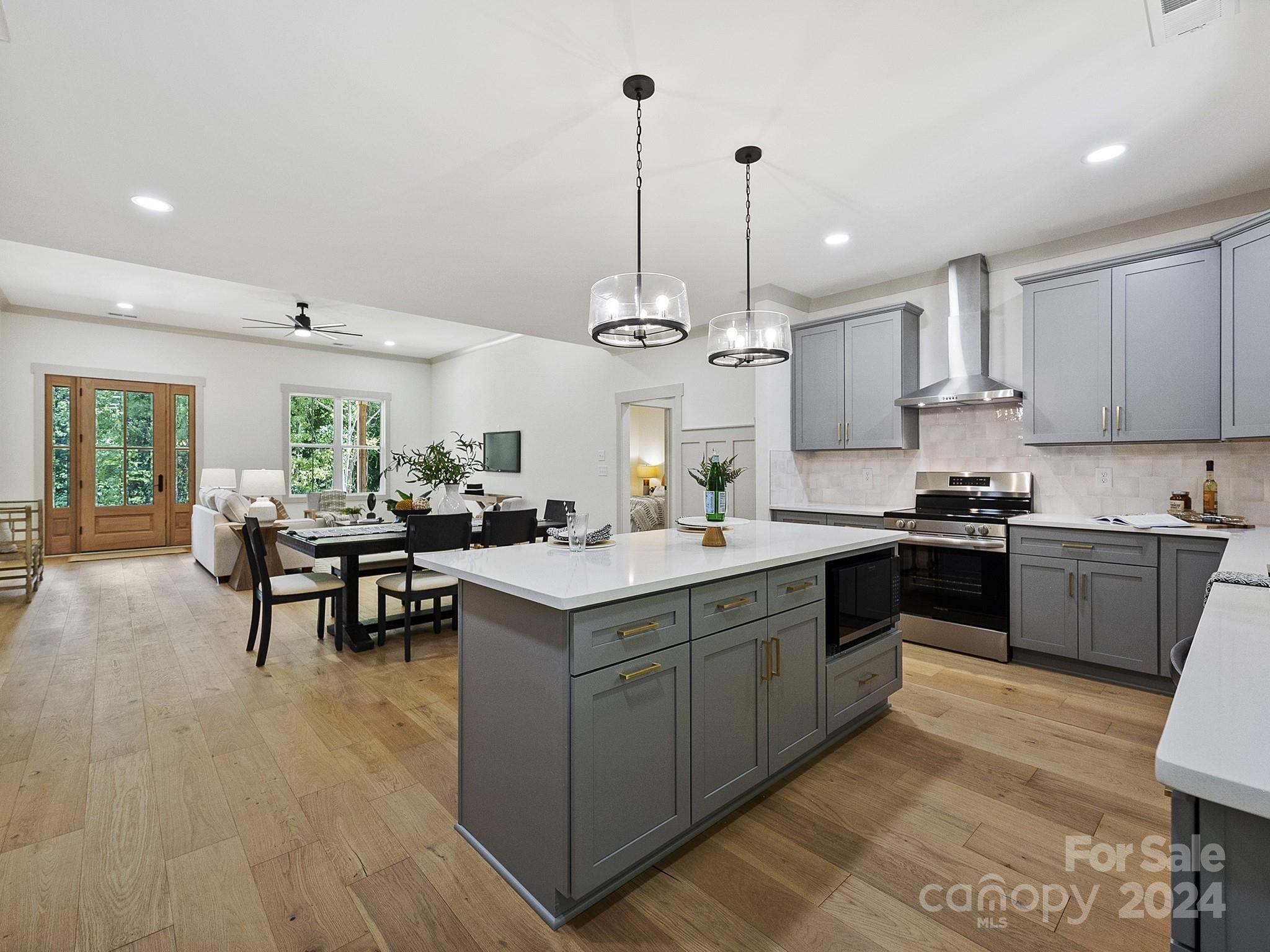 1438 Edgefield Road York, SC 29745 - Photo 11 of 36 a kitchen with kitchen island granite countertop a sink counter and chairs