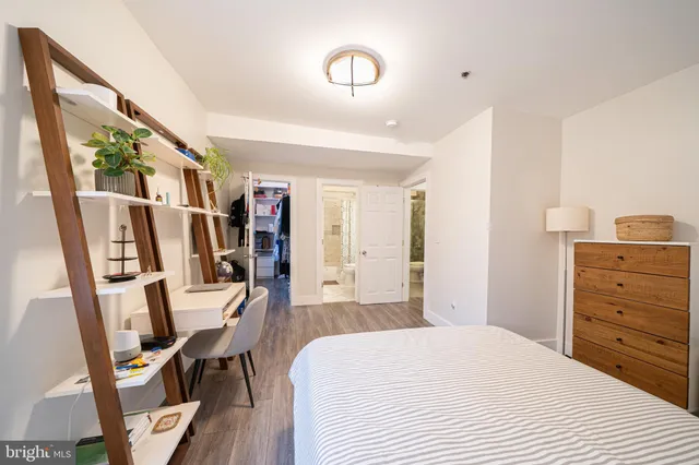 a bedroom with a bed and furniture