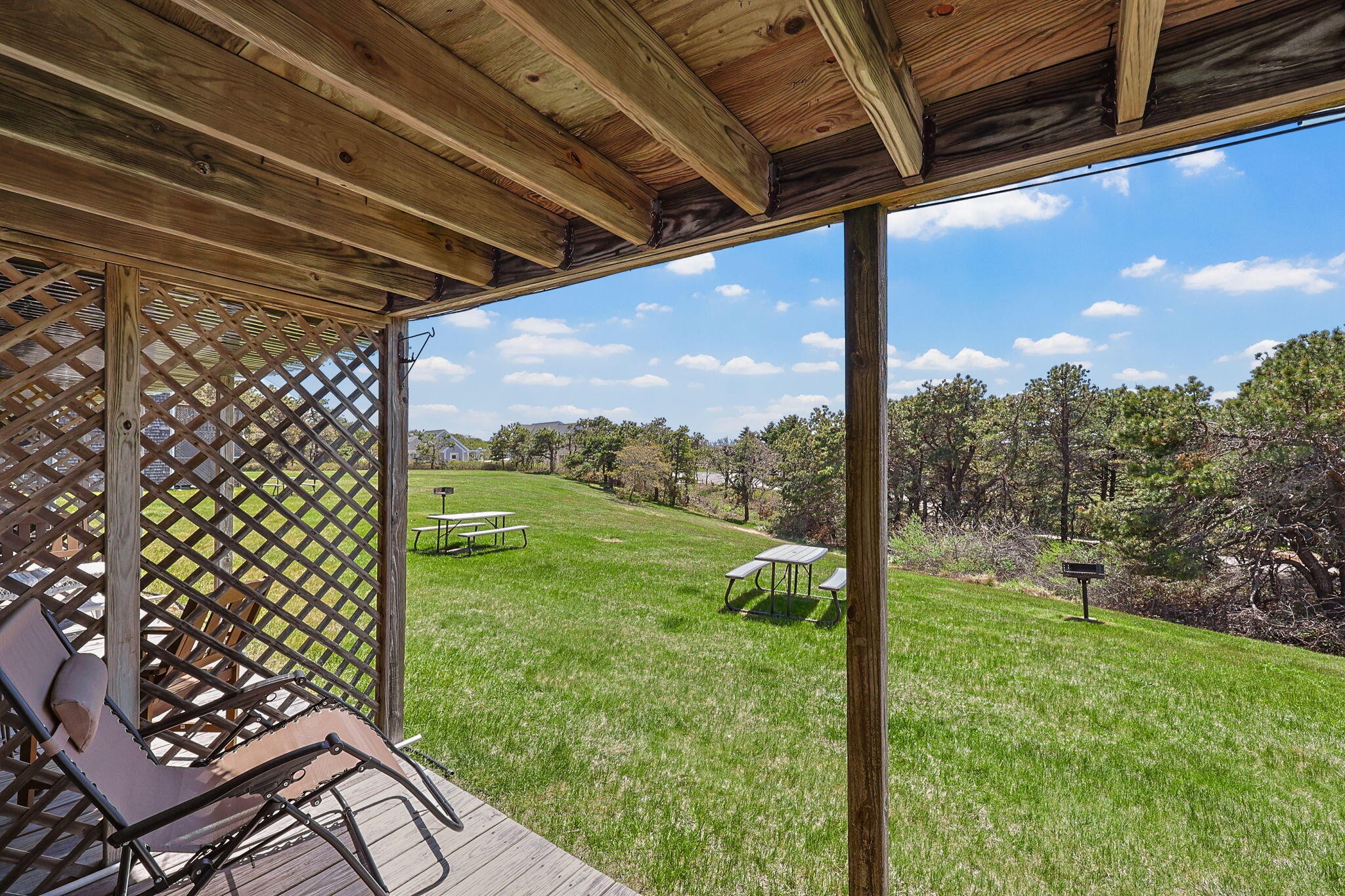 132 Shore Road, Unit 13 Truro, MA 02666 - Photo 17 of 21 a view of a porch with a swing