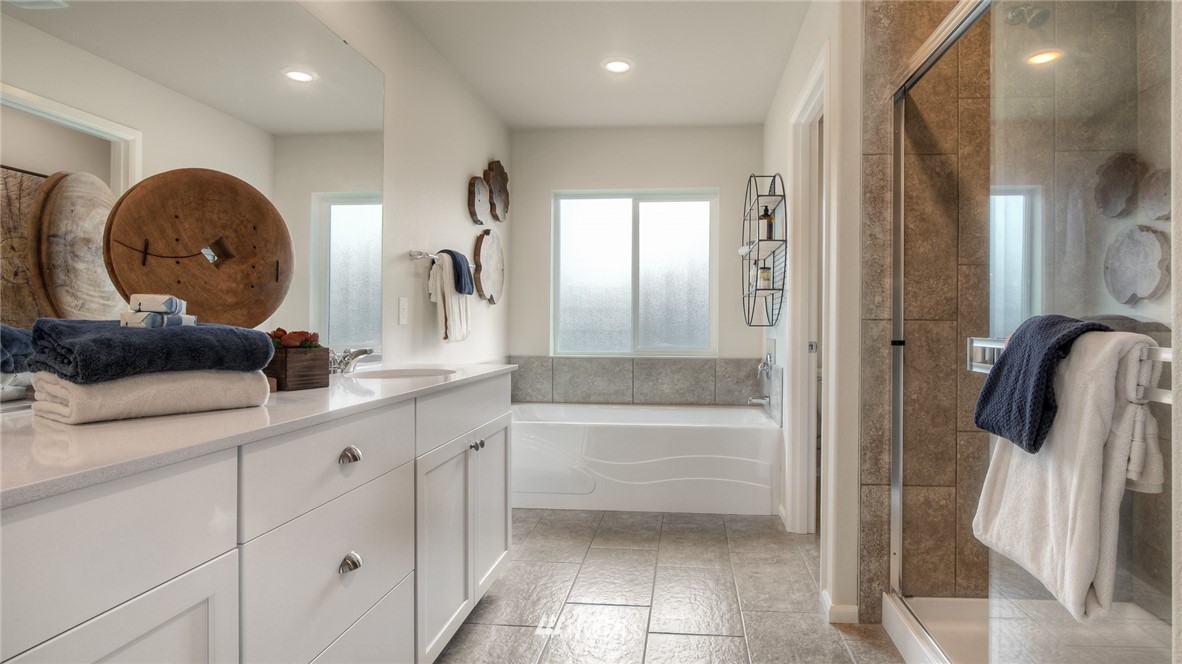 1376 Baker Hts Loop Bremerton, WA 98312 - Photo 12 of 19 a bathroom with a double vanity sink and a mirror