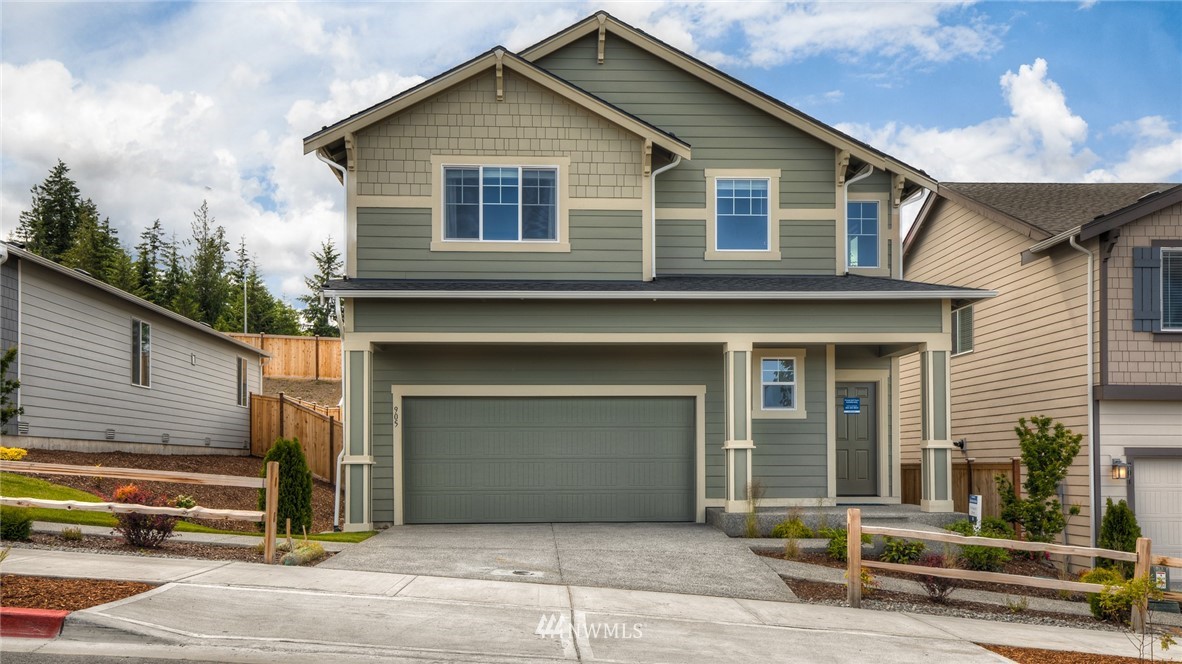 1376 Baker Hts Loop Bremerton, WA 98312 - Photo 2 of 19 a front view of a house with garage