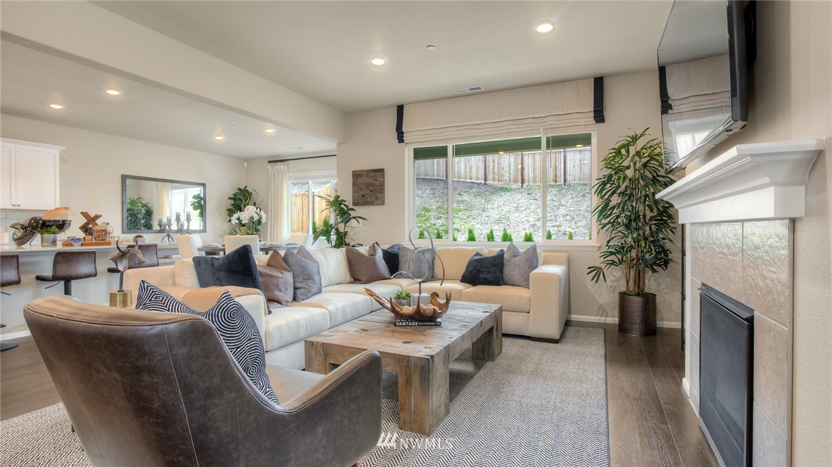 1376 Baker Hts Loop Bremerton, WA 98312 - Photo 5 of 19 a living room with furniture a large window and a fireplace
