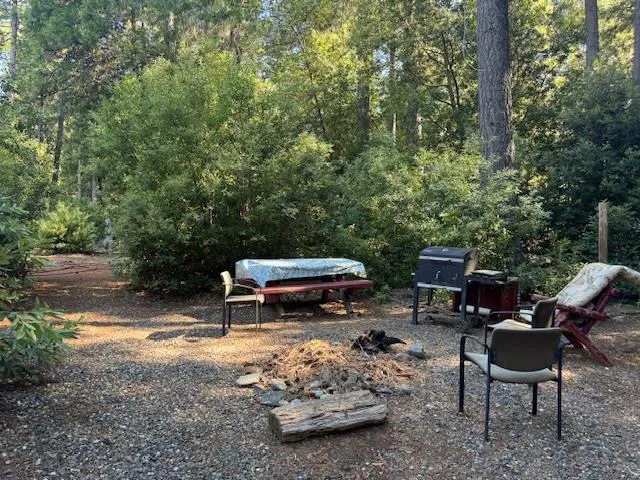 a backyard of a house with outdoor seating