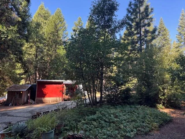a view of house with deck and outdoor seating