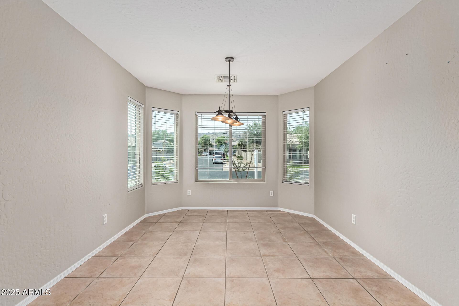1634 East Harwell Road Phoenix, AZ 85042 - Photo 12 of 44 a view of an empty room with a window