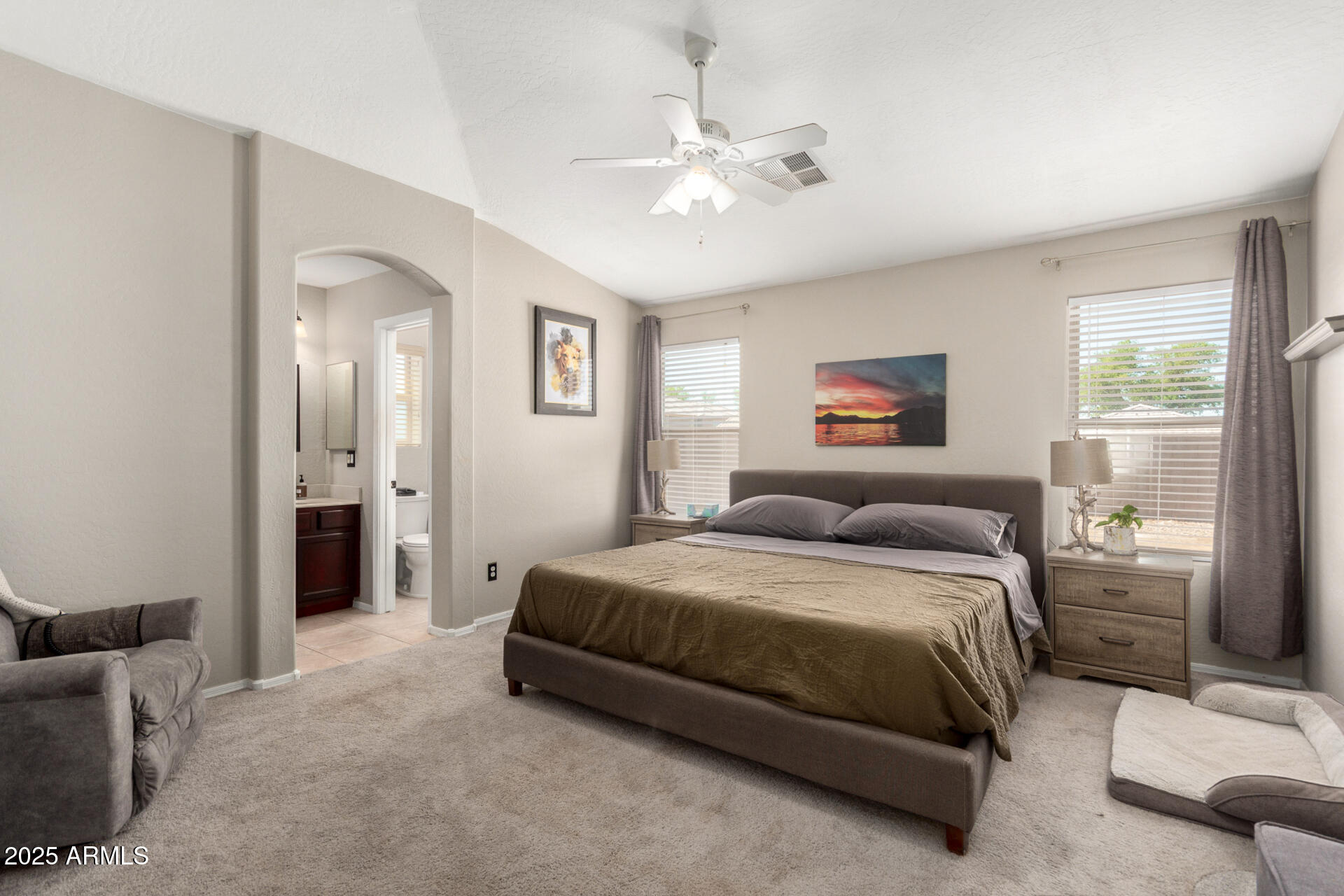 1634 East Harwell Road Phoenix, AZ 85042 - Photo 14 of 44 a bed room with a bed and a chandelier