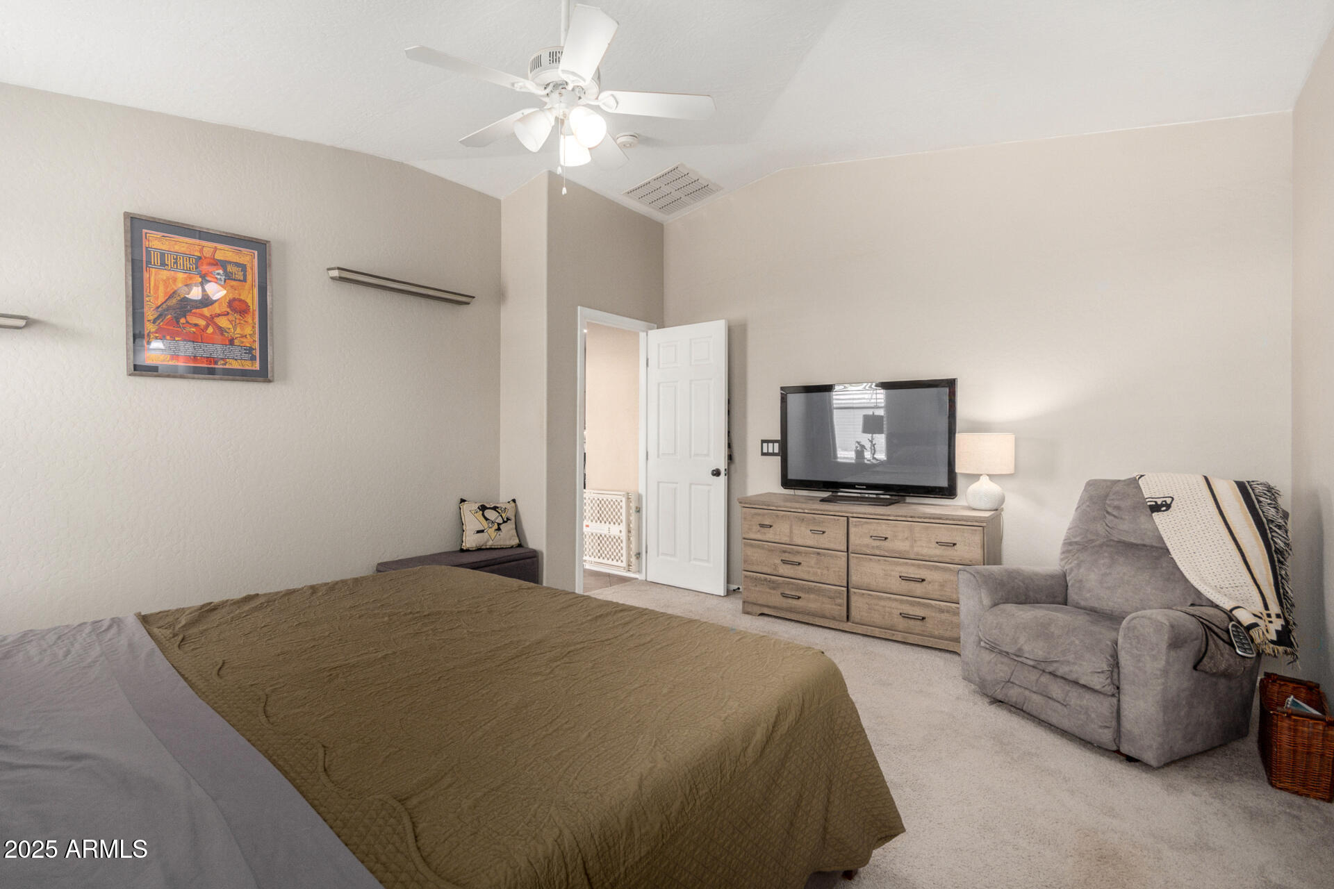 1634 East Harwell Road Phoenix, AZ 85042 - Photo 16 of 44 a bedroom with a bed and a flat screen tv