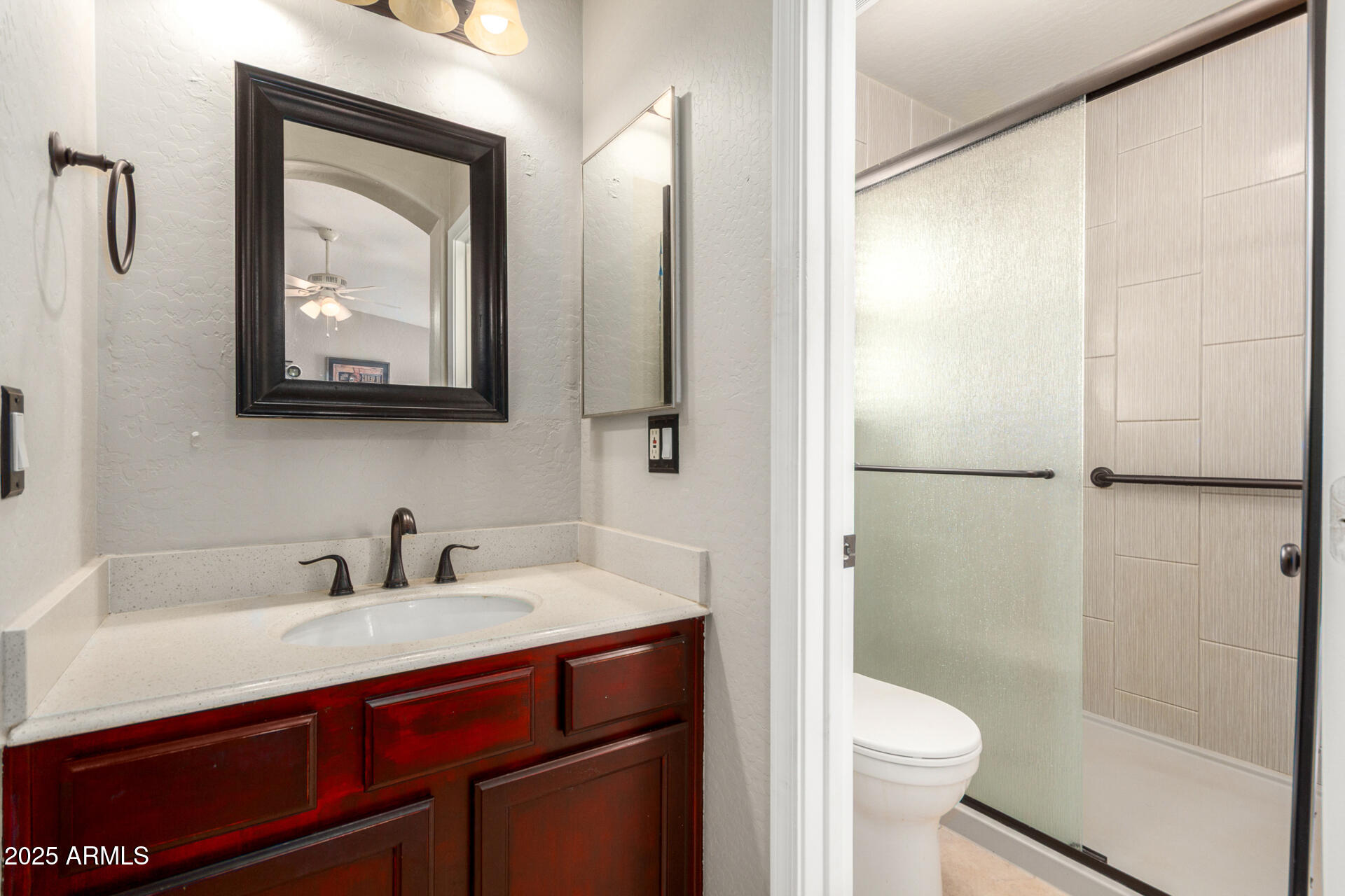 1634 East Harwell Road Phoenix, AZ 85042 - Photo 19 of 44 a bathroom with a sink and a mirror