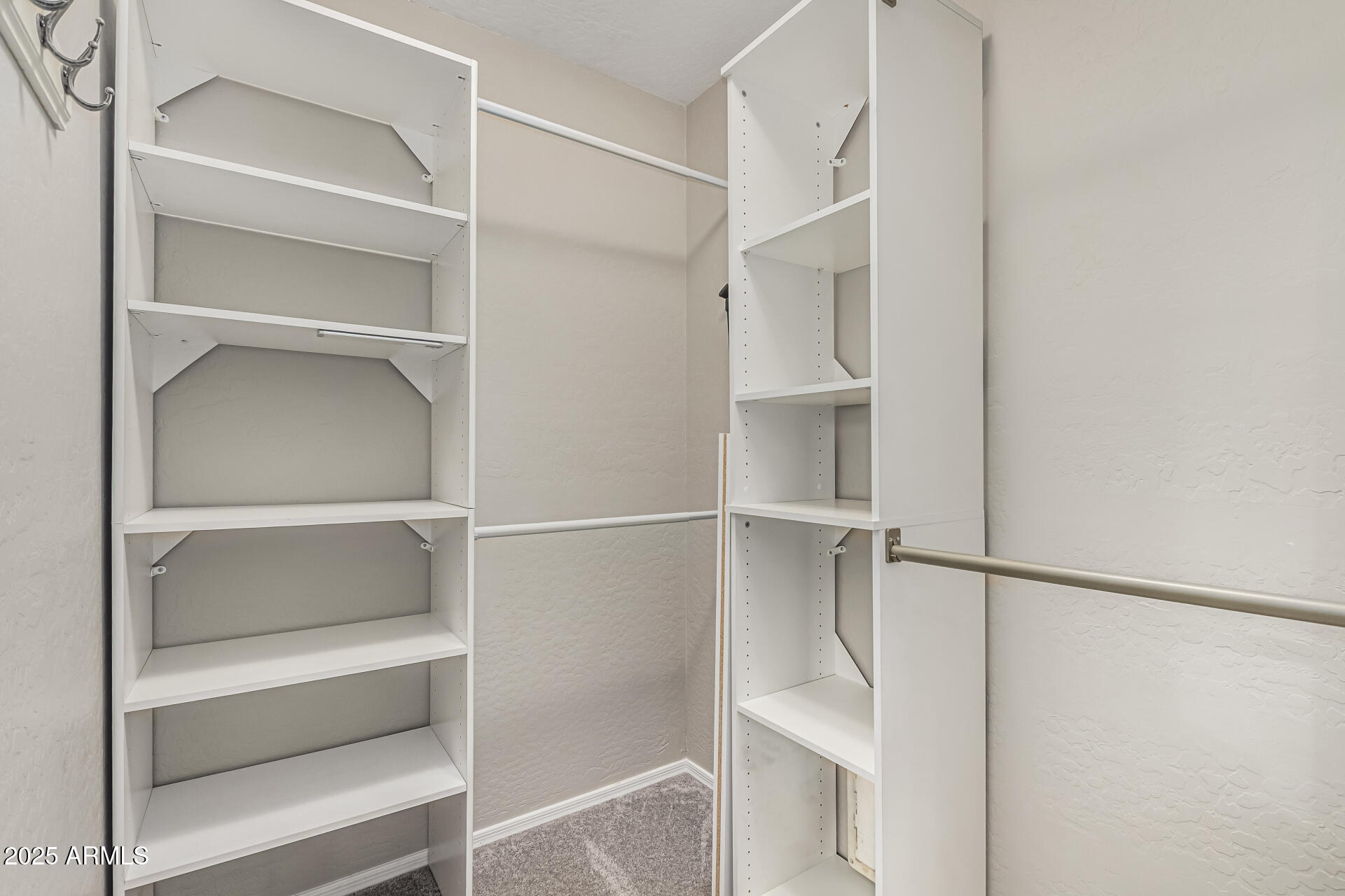 1634 East Harwell Road Phoenix, AZ 85042 - Photo 20 of 44 a view of an empty walk in closet