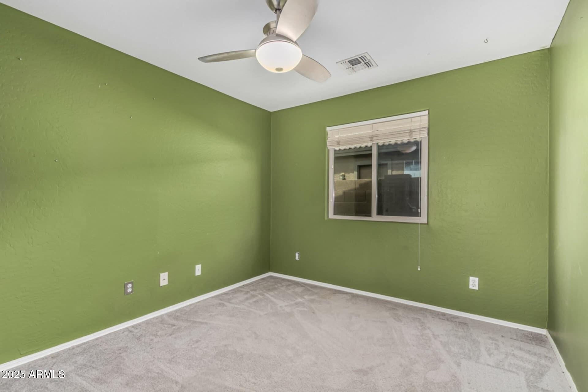1634 East Harwell Road Phoenix, AZ 85042 - Photo 28 of 44 a view of a room that has a fan and a window
