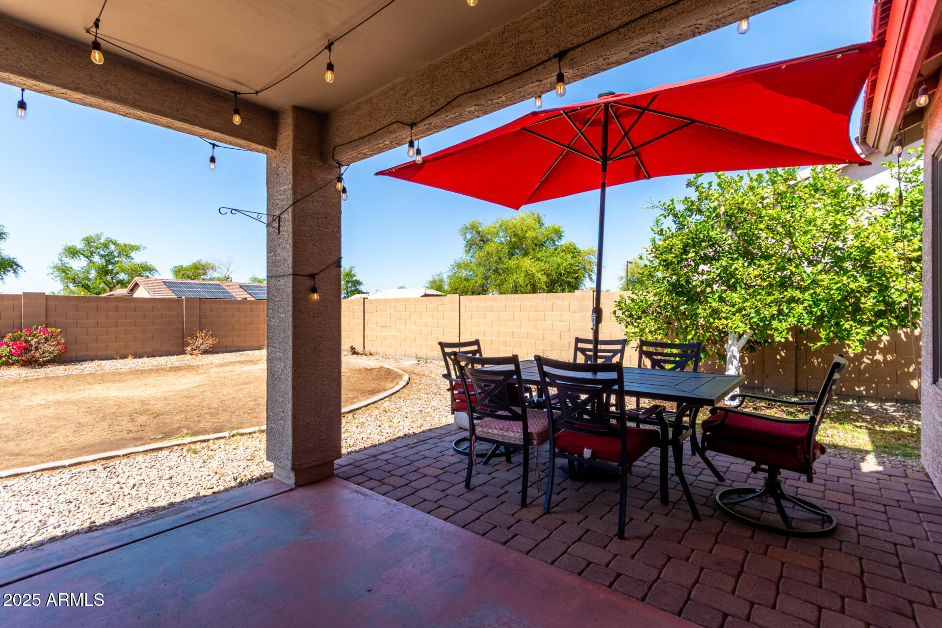 1634 East Harwell Road Phoenix, AZ 85042 - Photo 35 of 44 a view of a patio with table and chairs under an umbrella