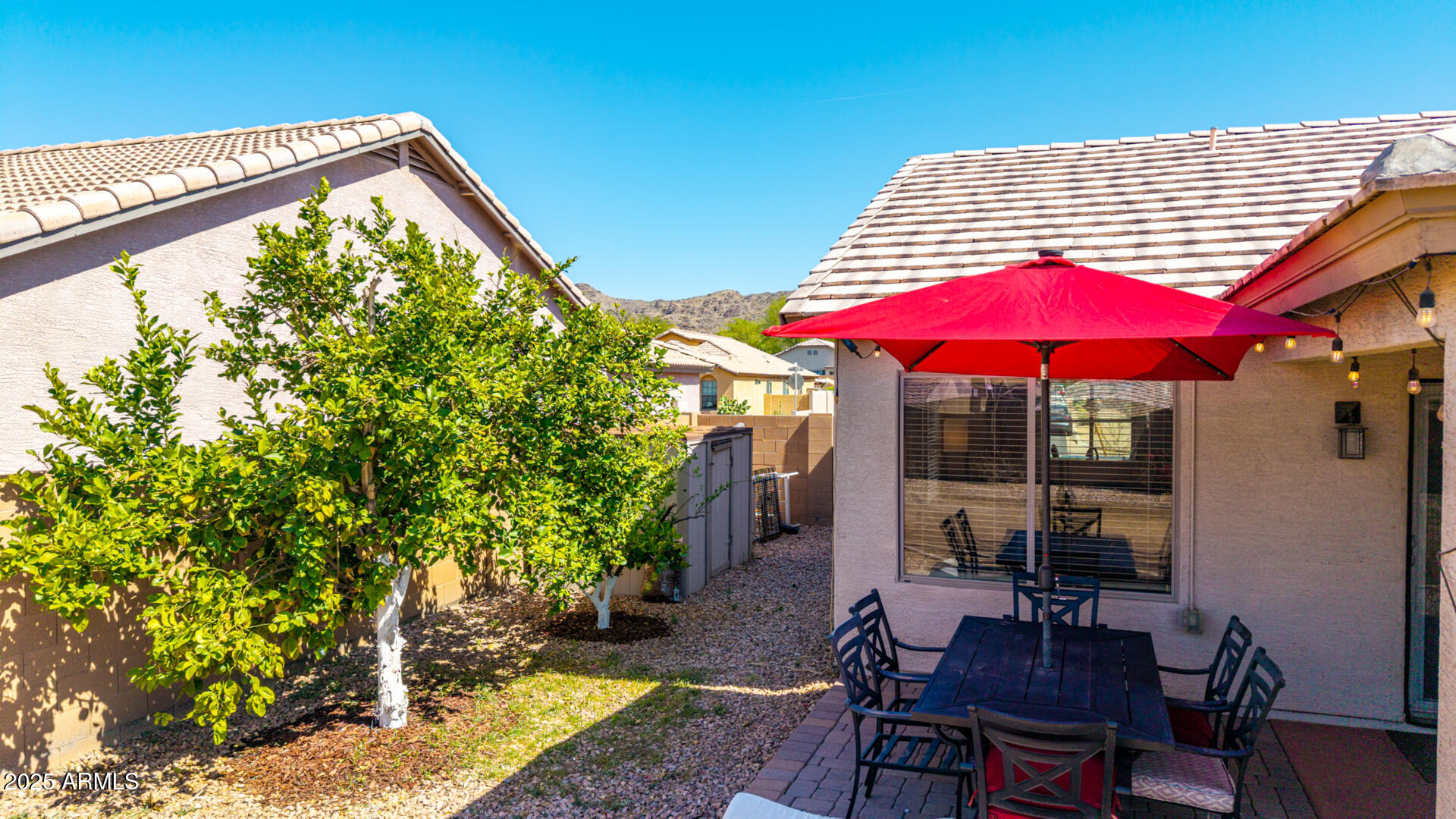 1634 East Harwell Road Phoenix, AZ 85042 - Photo 36 of 44 a view of balcony with chairs and umbrella